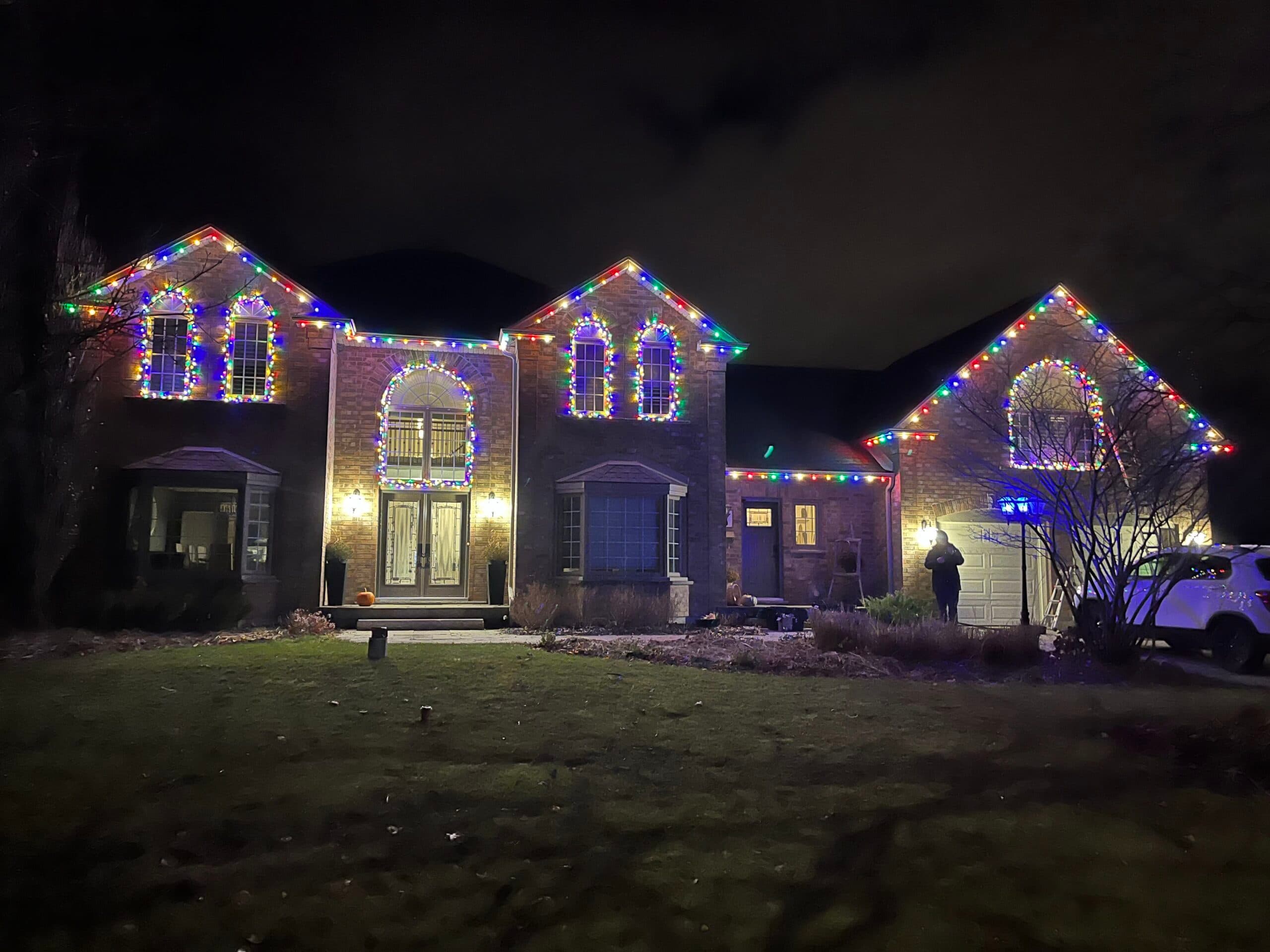 Professional wreath installation on front door of home in London Ontario