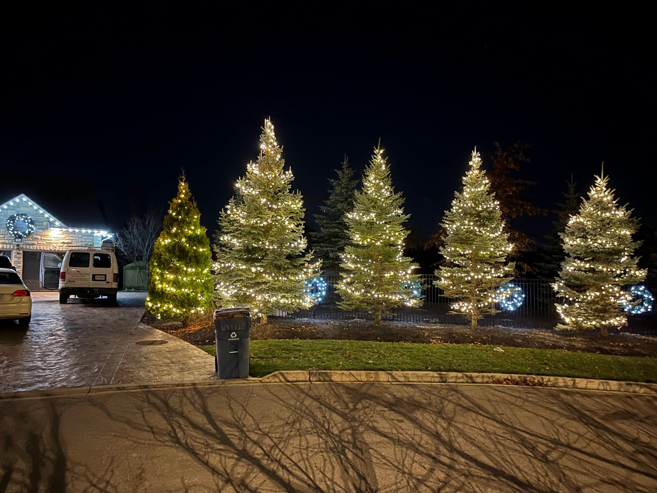 Christmas Lights London team installing lights on a home roofline in London Ontario