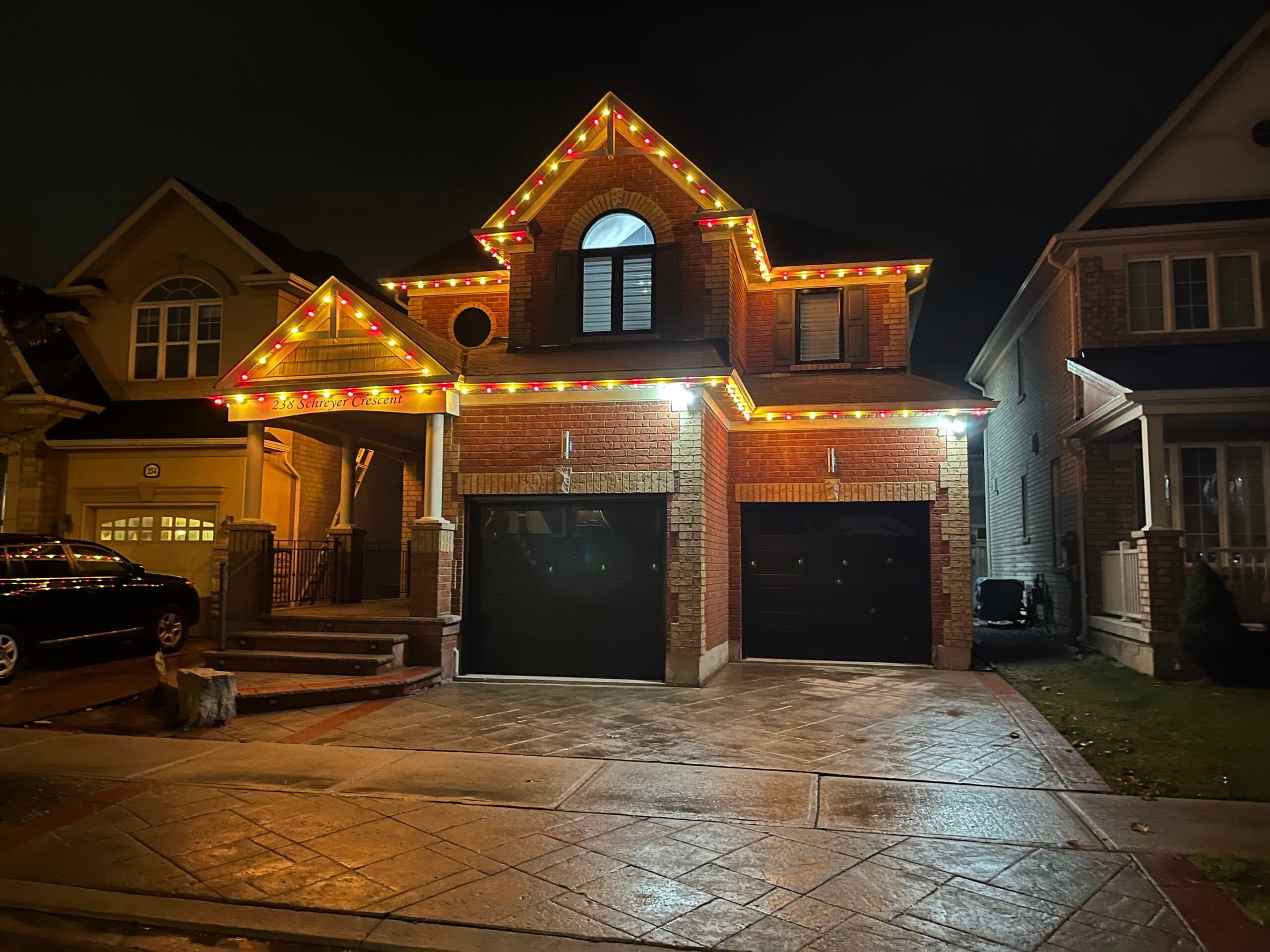 Professional garland installation on porch railing of home in London Ontario
